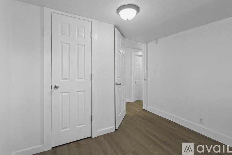 A white door is on the left and a white door is on the right.