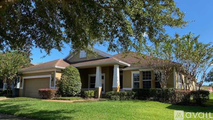 A house with a garage and a front yard.