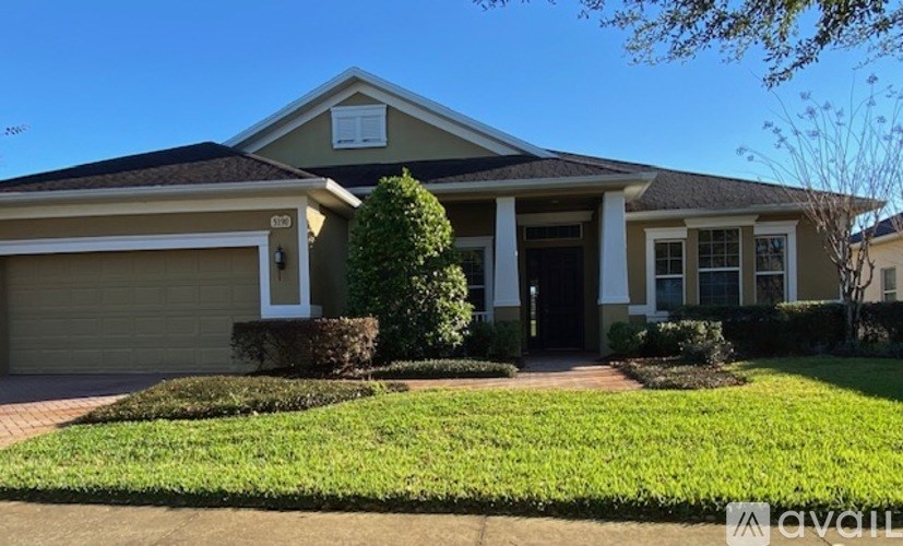 A house with a garage and a front yard.