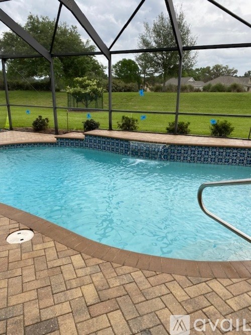 A small pool with a brown tile border.
