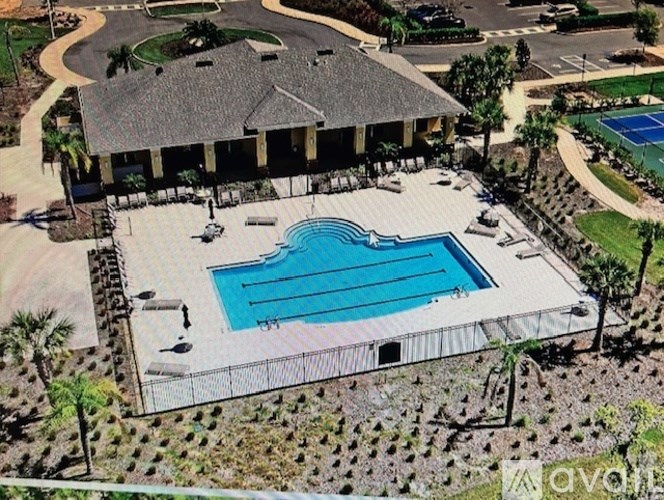 A large house with a pool in the backyard.