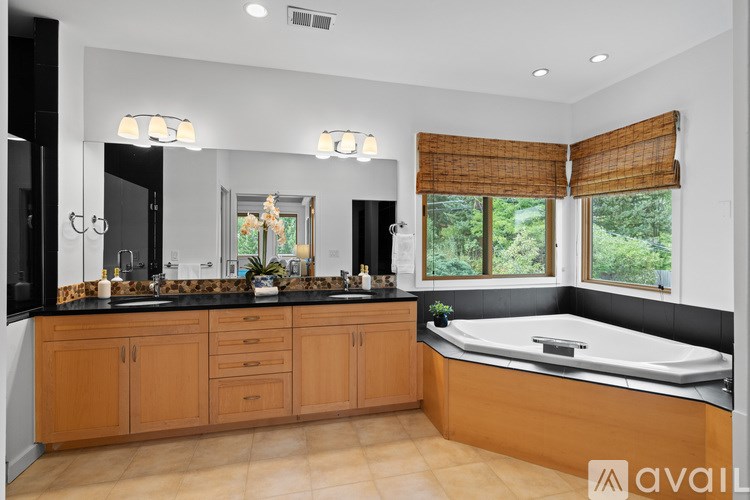 A floor plan of a house with a bedroom, bathroom, laundry, hall, and recreation room.