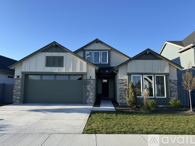 A modern house with a garage and a driveway.