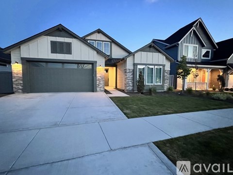 A house with a garage is available for sale.