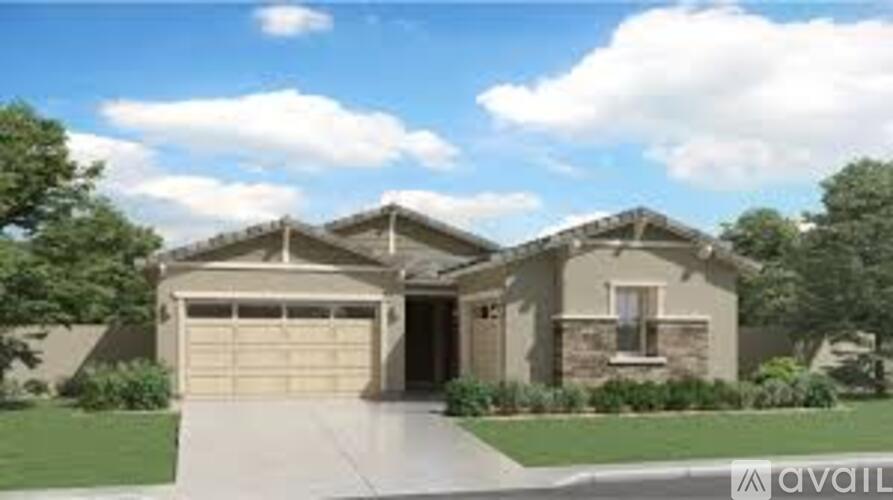 A house with a garage is for sale.