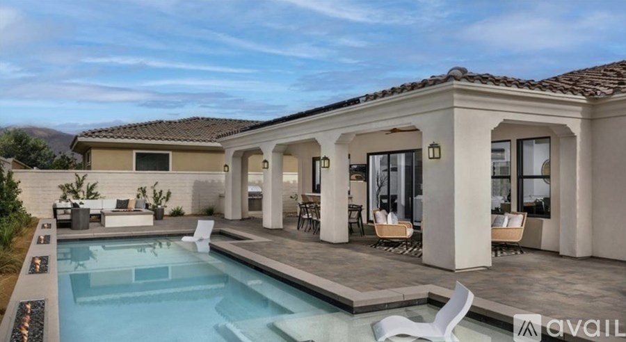 A modern house with a pool in the backyard.