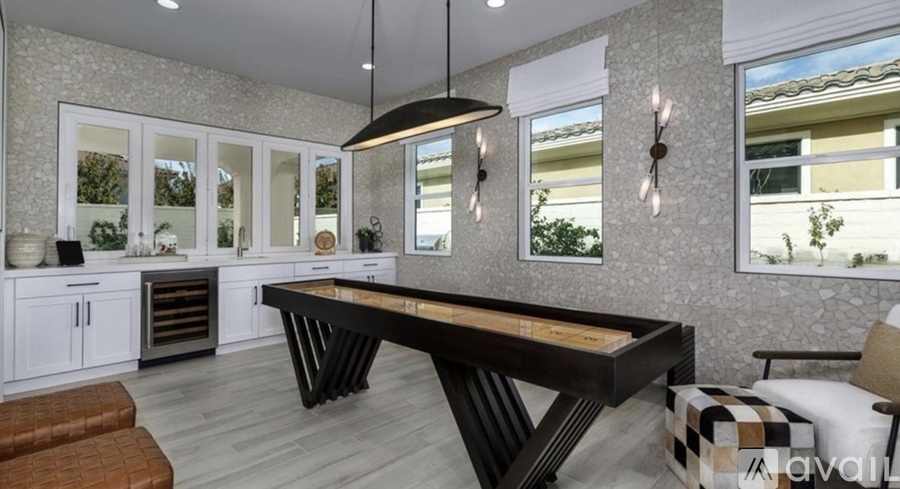 A modern kitchen with a large island in the center.