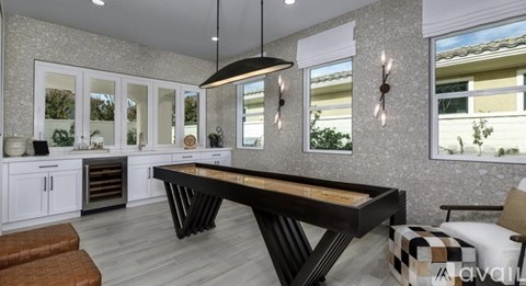 A modern kitchen with a large island in the center.