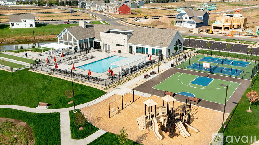 A park with a basketball court, a tennis court, a playground, and a swimming pool.