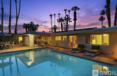 A house with a pool in the evening.