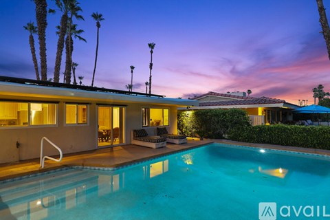 A house with a pool in the backyard.