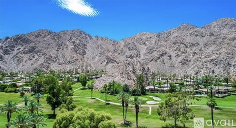 A golf course with a mountain in the background.