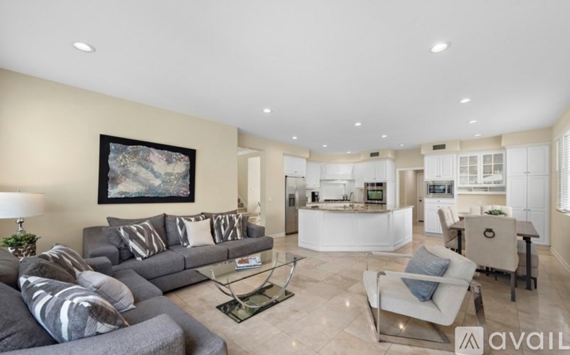 A living room with a grey sofa and a coffee table.