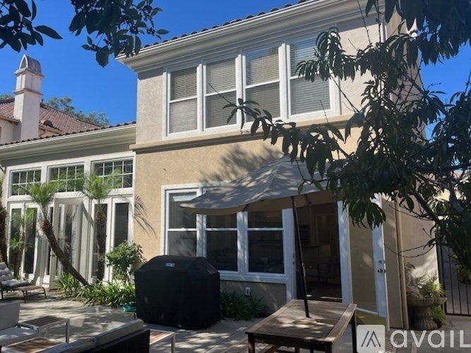 A kitchen with granite countertops and white cabinets.