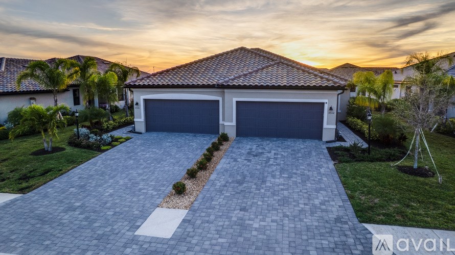 A white bathroom with a toilet and a sink.