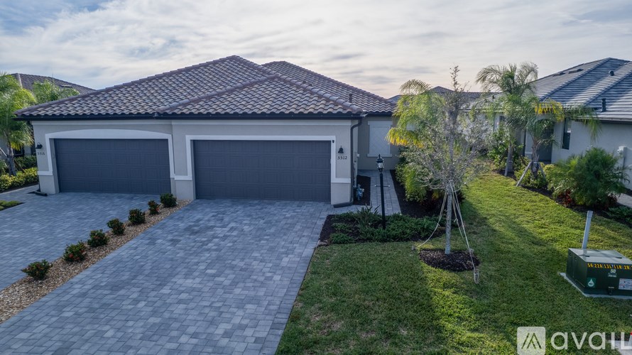 A large building with a pool in front of it.