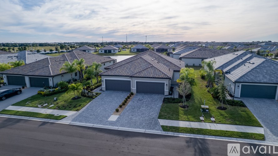 A park with a tennis court, a swimming pool, and a basketball court.