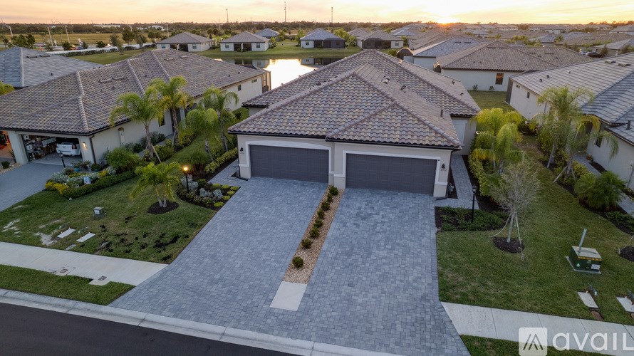 A house with a driveway in front of it is available for sale.