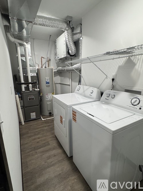 A laundry room with a washer and dryer.