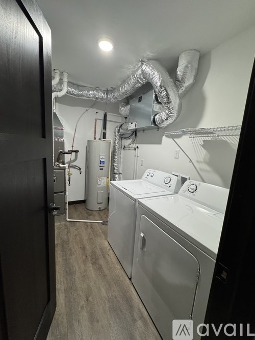 A laundry room with a washer and dryer.