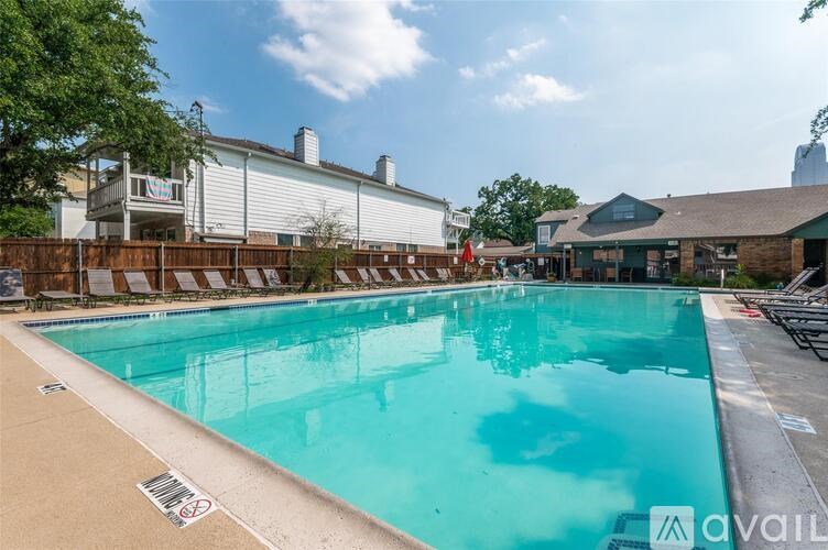 A large swimming pool with a blue tinted water.