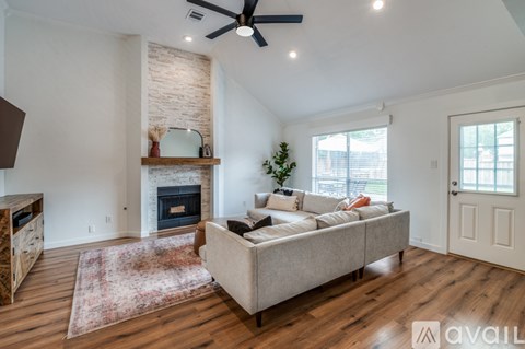 A living room with a fireplace and a couch.
