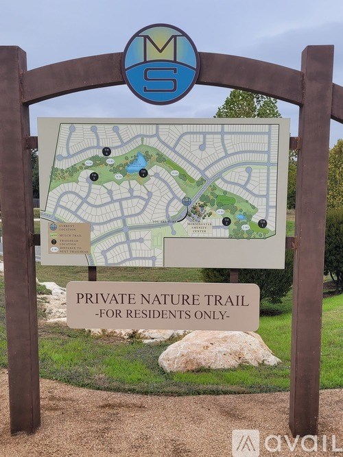 A sign for a private nature trail for residents only is displayed.