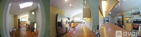 A modern kitchen with wooden cabinets and stainless steel appliances.