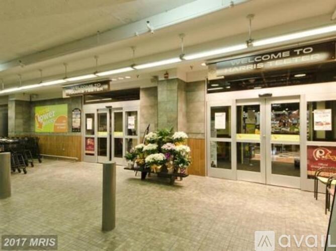 A large indoor space with a "Welcome to" sign above the entrance.