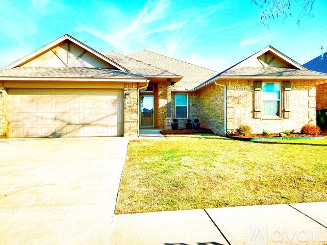A house with a brown roof and a garage door.