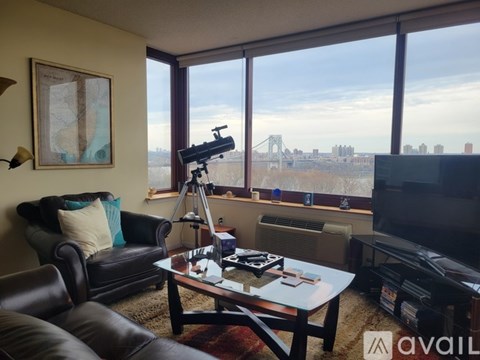A living room with a telescope on the coffee table.