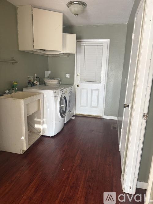 A laundry room with a washer and dryer.