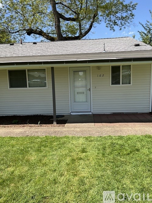 A house with the number 162 on the front door.