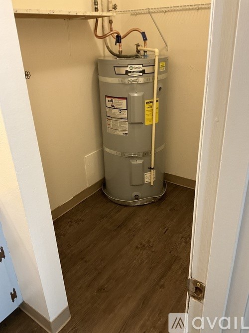 A water heater is installed in a small room.
