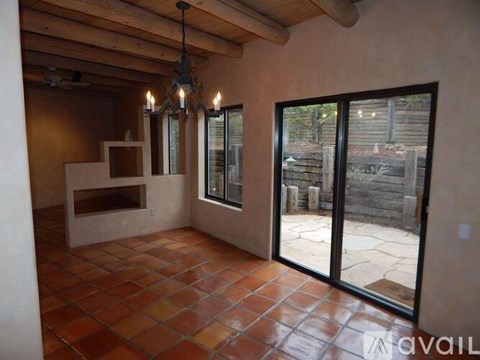 A room with a tiled floor and a chandelier.