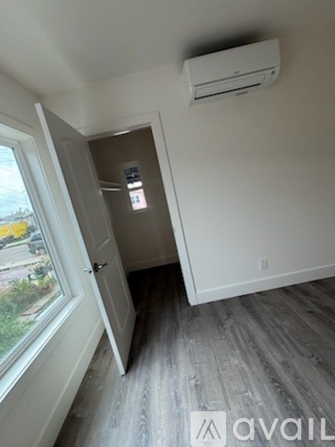 A room with a door and a window.