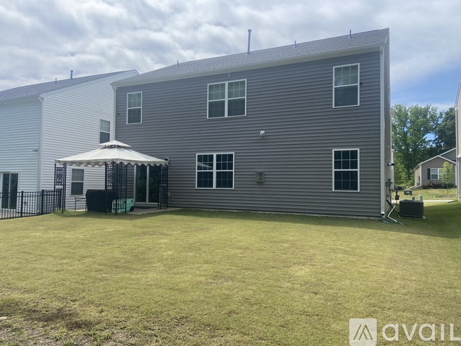 A house with a patio and a gazebo is for sale.