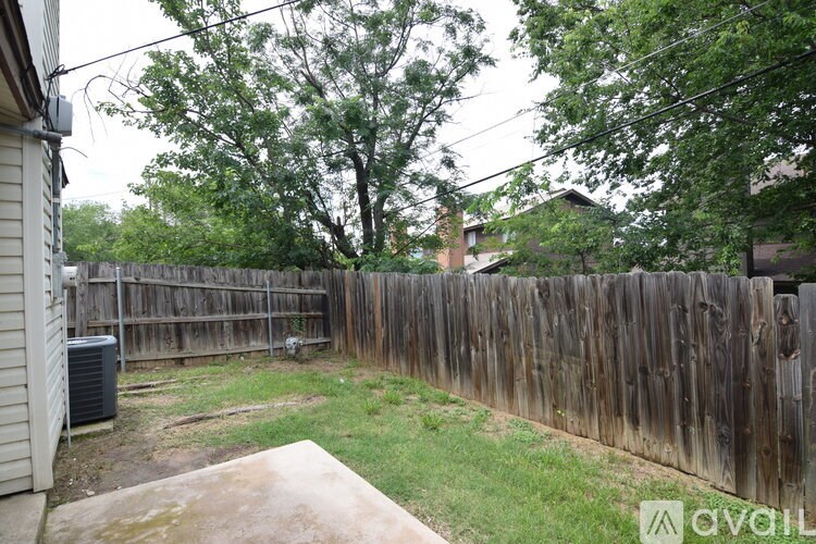 A kitchen with white appliances and cabinets.