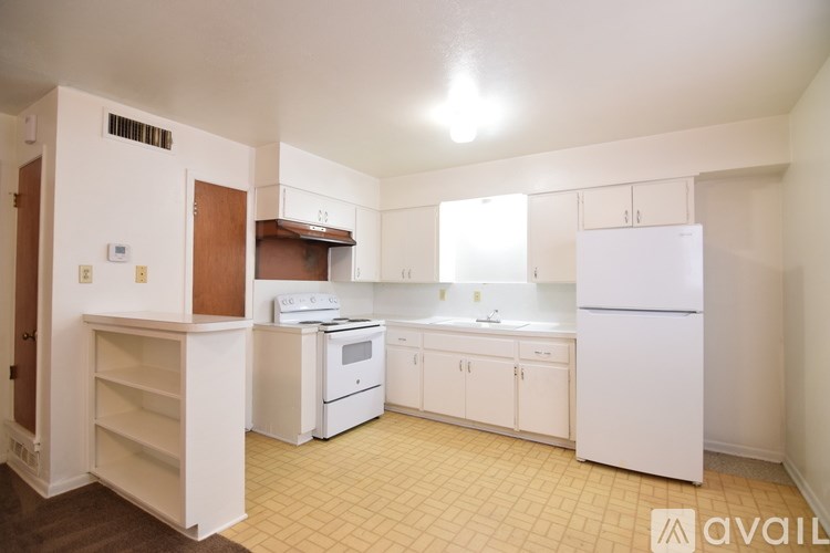 A house with a brown brick exterior and a white door.