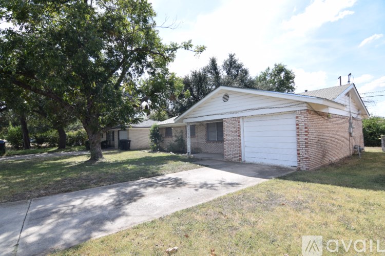 A house with a white garage door is for sale.