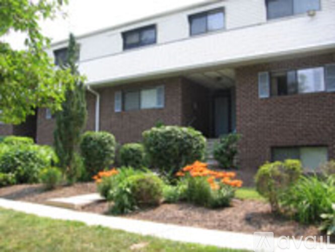 A building with a garden in front of it.