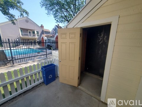 A pool surrounded by a black fence with the logo Avail on it.