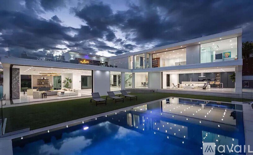 A modern house with a pool in the backyard.