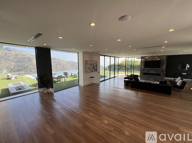 A modern kitchen with a dining table set for two.