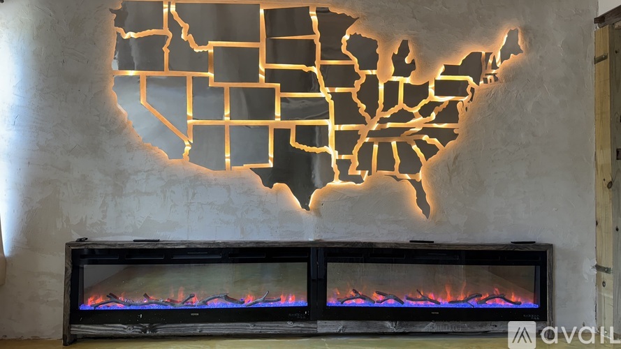 A wall-mounted map of the United States is illuminated from behind.