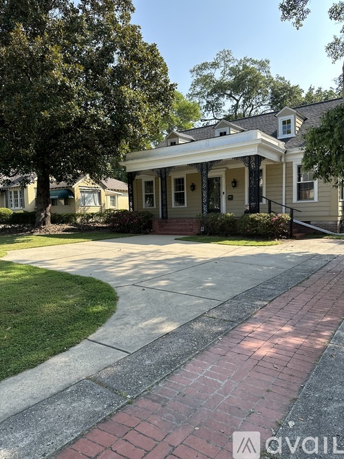 A house with a front porch and a driveway.