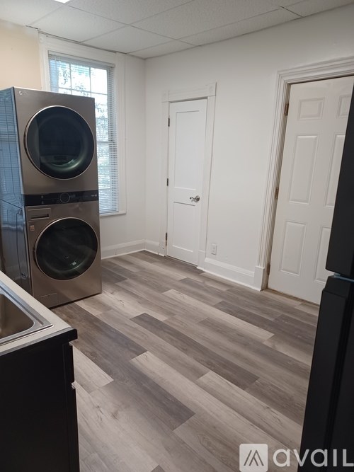 A room with a washer and dryer in it.