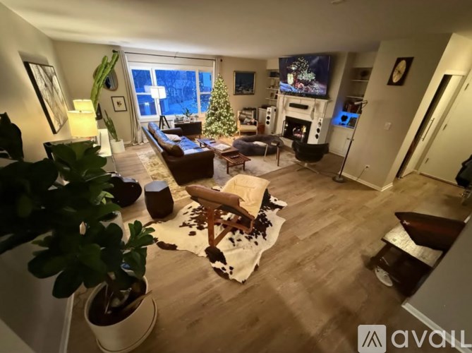 A kitchen with a refrigerator, oven, and sink.