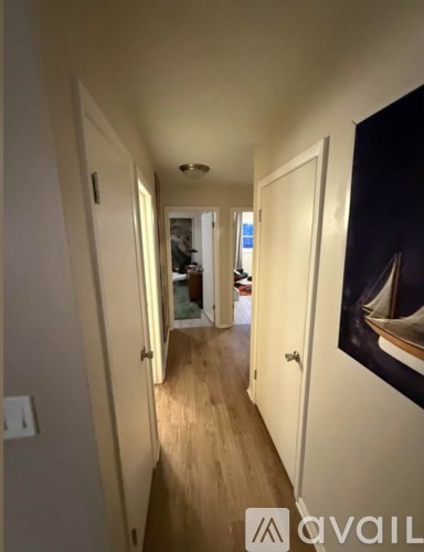 A bathroom with a toilet, sink, and shower.