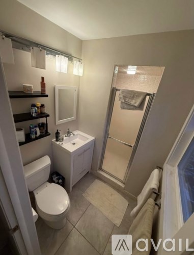 A person is holding an employee survey questionnaire with various questions listed.